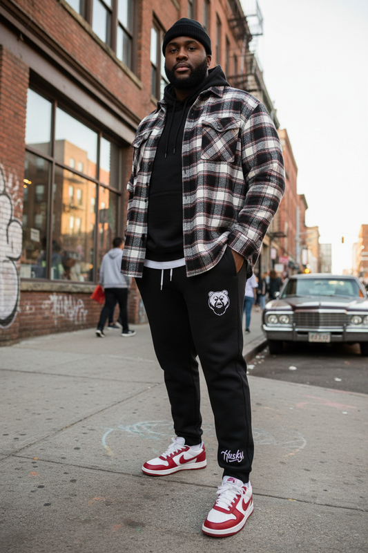 Heavyset Black male in Husky Classic Black Jogger with red Nike Dunks
