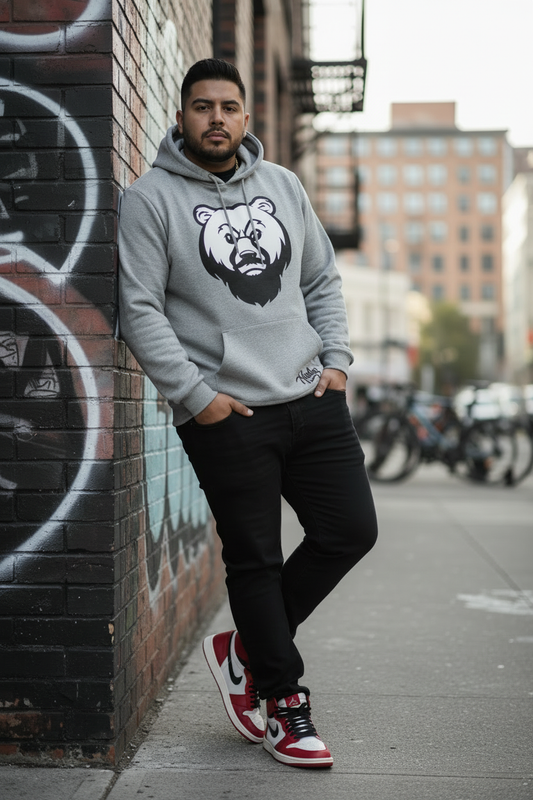 Plus-size Black man in gray OG Bear hoodie with Jordan 1s